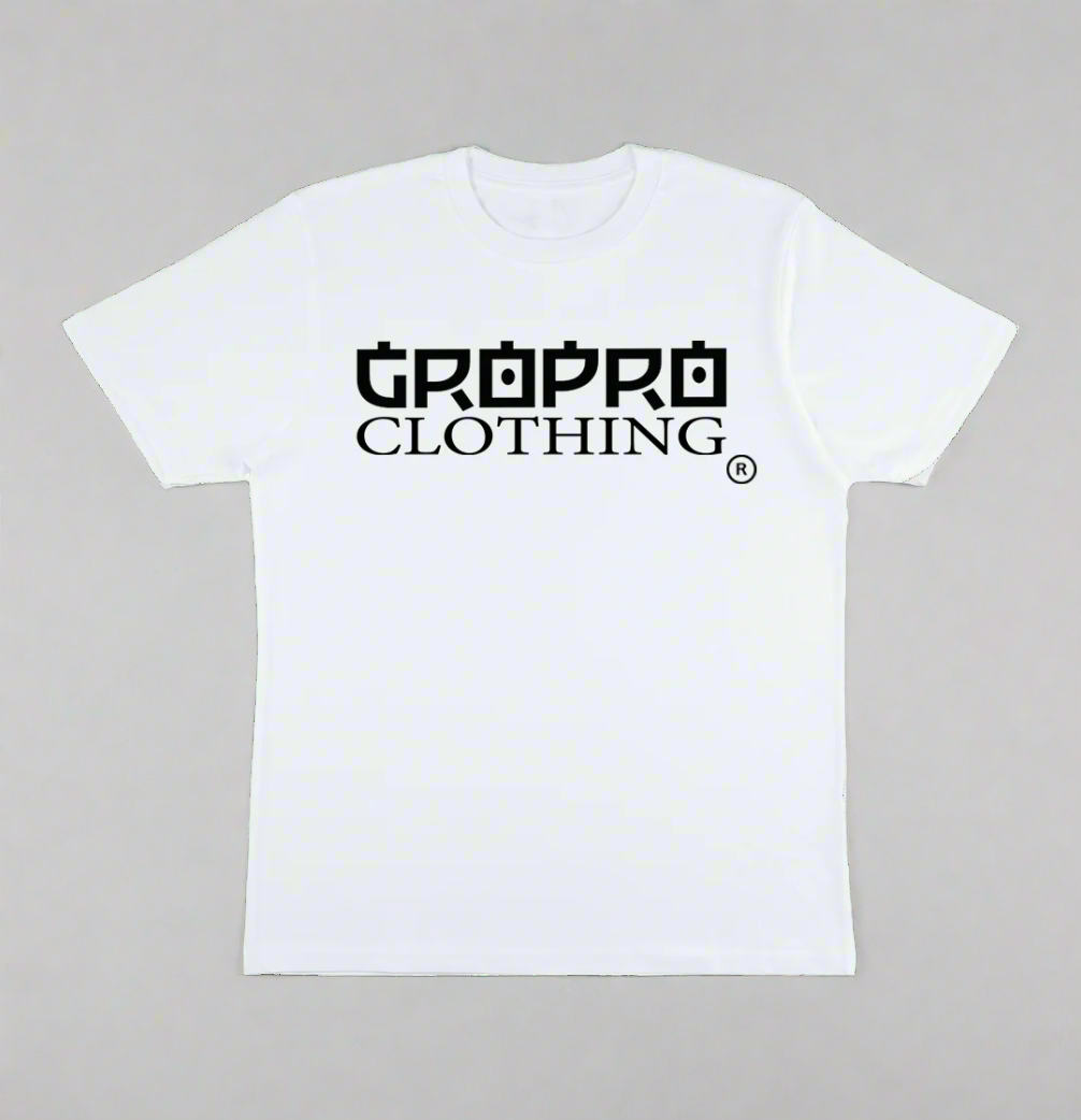 White t-shirt with a Black GROPRO Clothing logo across the chest on a sand coloured background.
