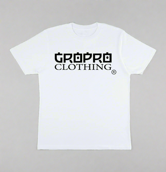 White t-shirt with a Black GROPRO Clothing logo across the chest on a sand coloured background.