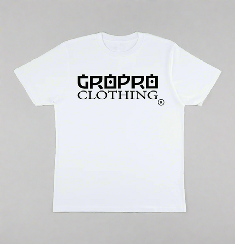 White t-shirt with a Black GROPRO Clothing logo across the chest on a sand coloured background.