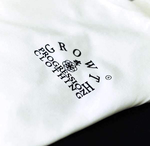 growth & progression Arch logo on a white t-shirt with black text 